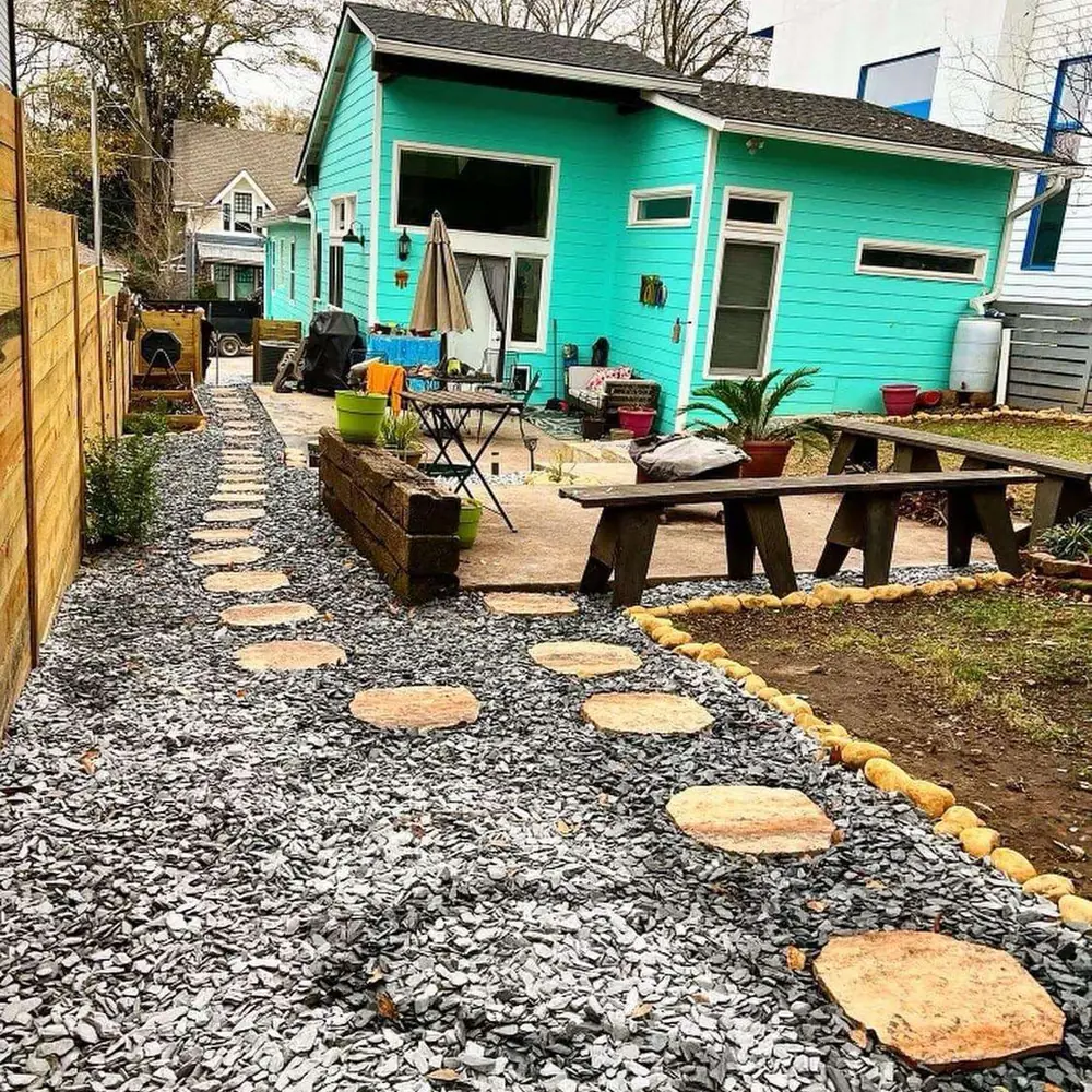 Backyard makeover with stepping stones and raised beds by Grantlanta Lawn
